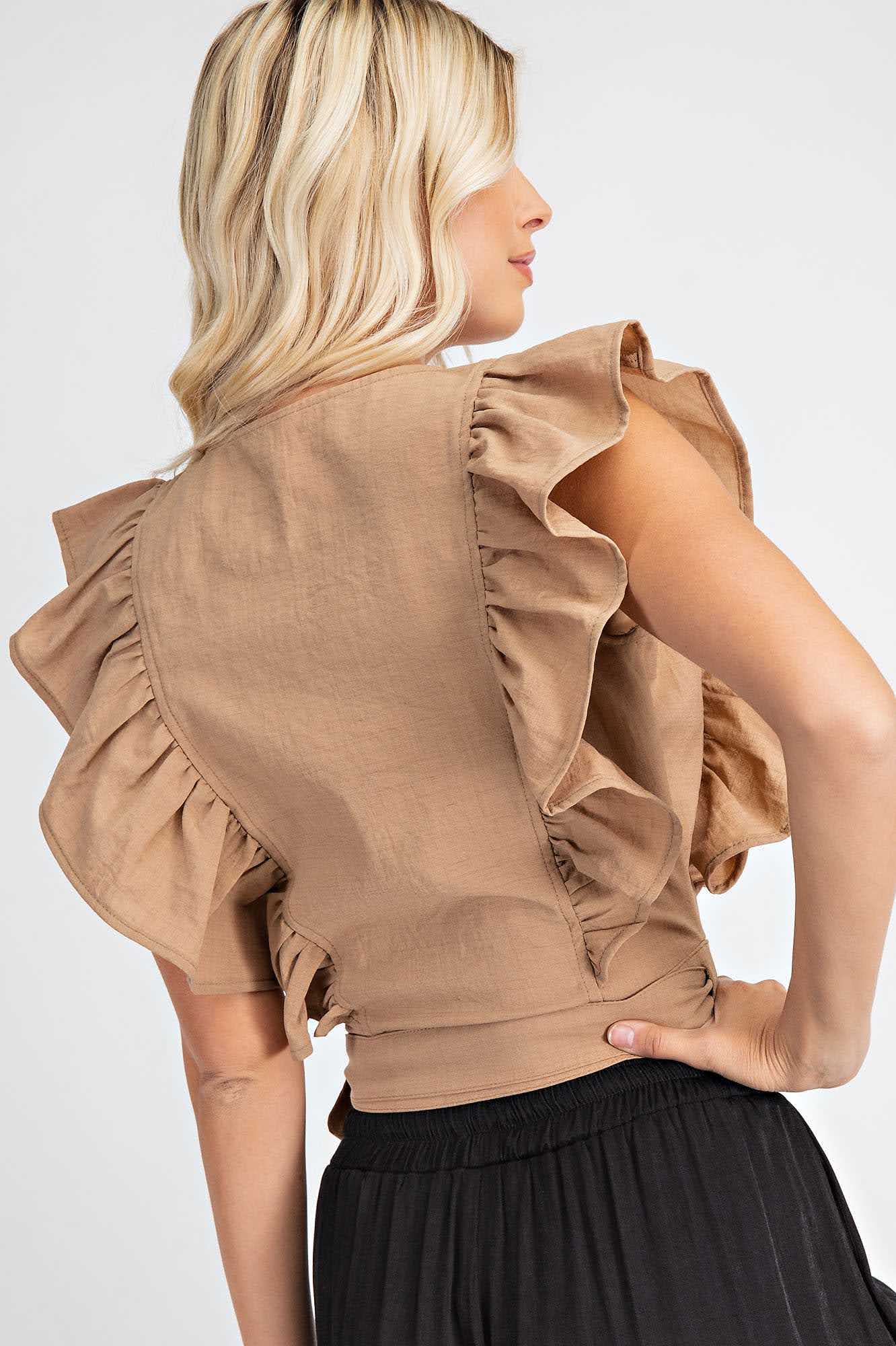 Update your wardrobe with our versatile and stylish Flutter Sleeve Crop Top. This top features a trendy tie in the front, and is made of 100% polyester for a comfortable fit. Perfect for any occasion, this top will elevate your Urban Western, Boho, Cowgirl, Chic, or Boho-Chic style. Available in Taupe, it's a must-have addition to your Women's Apparel collection.