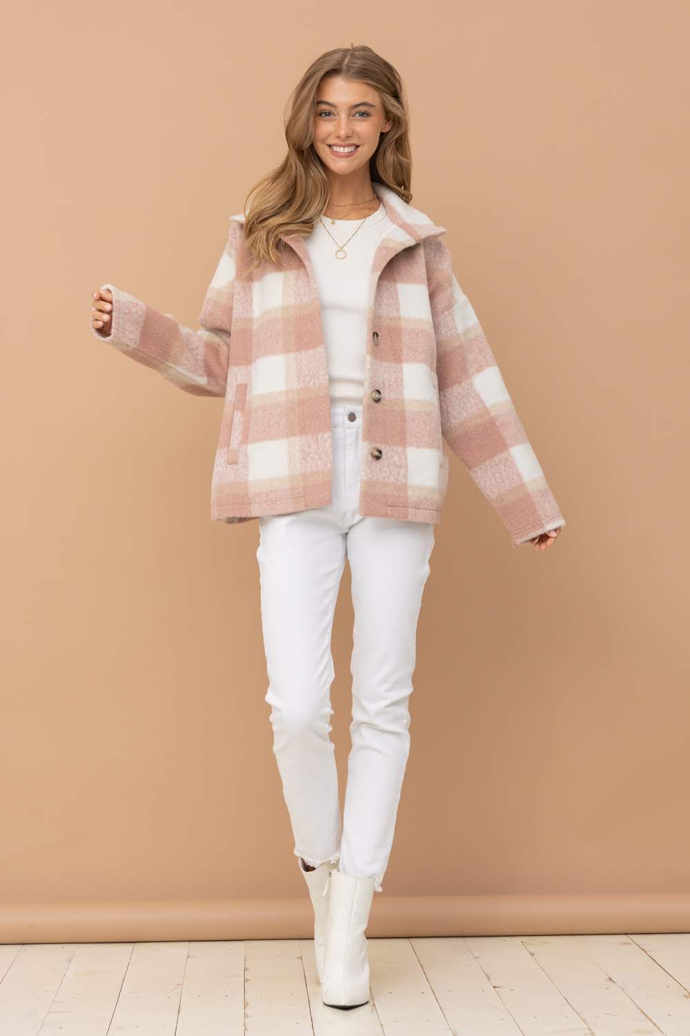 Expertly crafted with brushed yarn-dyed plaid material, this jacket from Blue B offers both style and functionality. The mock neck and button-up design add a touch of sophistication, while the side pockets provide convenience. The lovely rose color elevates any outfit.