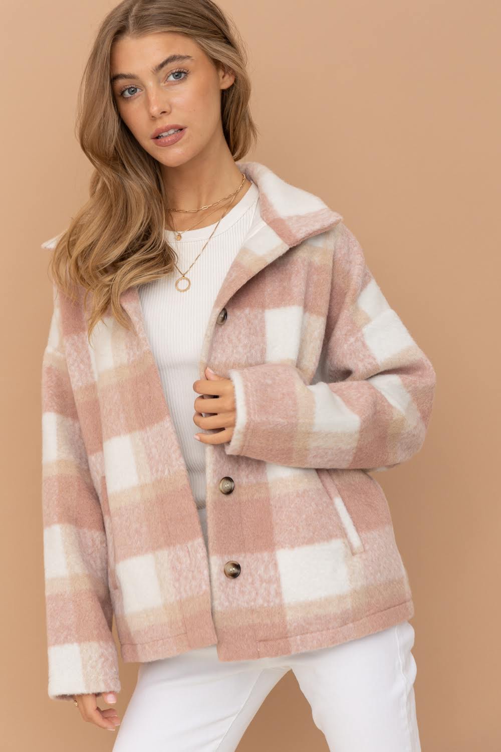 Expertly crafted with brushed yarn-dyed plaid material, this jacket from Blue B offers both style and functionality. The mock neck and button-up design add a touch of sophistication, while the side pockets provide convenience. The lovely rose color elevates any outfit.