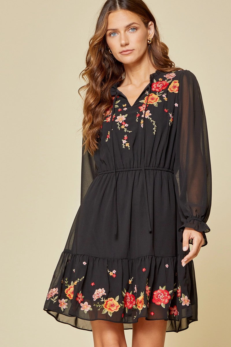 Indulge in the luxurious and exclusive style of the Embroidered Dress by Savanna Jane. This Boho-inspired dress combines chic and western fashion for a sophisticated and elegant ensemble. Made with high-quality denim, this dress is the perfect essential for any cowgirl or urban western fashion lover. Elevate your wardrobe with this bohemian and boho-chic style that exudes the essence of women's apparel.