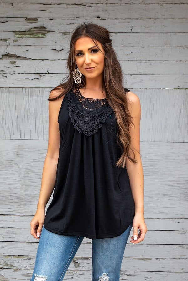 Inspired by the Urban Western and Boho styles, this Mia Black Sleeveless Top features delicate crochet details on the front. Add a touch of chic and bohemian flair to your wardrobe with this versatile and stylish top. Perfect for any cowgirl looking to elevate her fashion game!