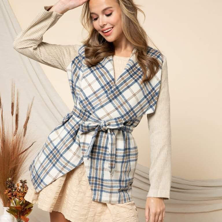 Stay warm and stylish with the Ezra Plaid Lightweight Jacket. Featuring a cream color and trendy plaid print, this jacket is perfect for any occasion. The shawl collar and belted waist add a touch of sophistication while the corduroy sleeves offer a unique twist. Embrace your inner Boho-Chic and Urban Western style with this must-have essential.