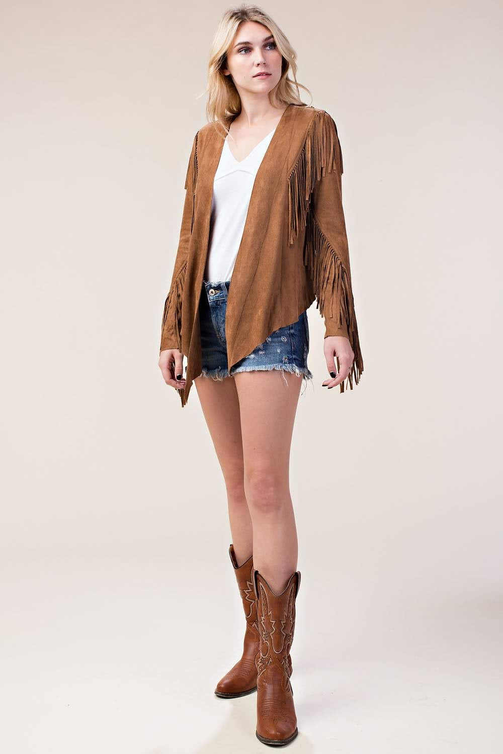 Elevate your style with our Faux Suede Jacket with Fringe in classic camel! This jacket features long sleeves and an open front, perfect for layering. The statement fringe details along the trim and sleeves add a touch of boho-chic to your look. With a whip-stitched back yoke and asymmetrical hem, this jacket is a must-have in any fashionista's wardrobe.
