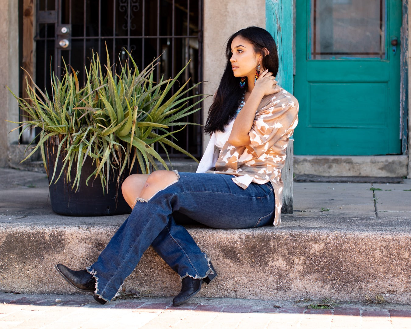 Expertly crafted with cowhide material in a relaxed-fit design, the Ara Cowhide Kimono adds a touch of western style to any outfit. Its eye-catching cowhide print makes a statement while providing comfort and effortless style.  Perfect for those looking to elevate their wardrobe with a touch of sophistication.