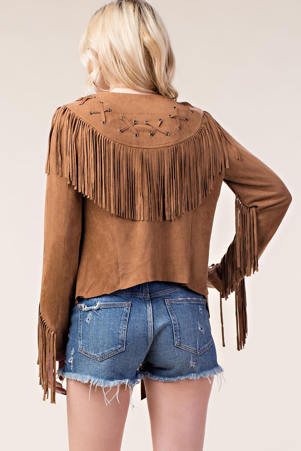 Elevate your style with our Faux Suede Jacket with Fringe in classic camel! This jacket features long sleeves and an open front, perfect for layering. The statement fringe details along the trim and sleeves add a touch of boho-chic to your look. With a whip-stitched back yoke and asymmetrical hem, this jacket is a must-have in any fashionista's wardrobe.