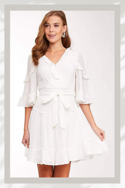 Experience bohemian-chic style in our Erin Ruffled V-neck Dress! This textured dress features a flattering V-neck, ruffled details, and a belted waist for a feminine touch. With half sleeves and a back zipper closure, it's both stylish and practical. Perfect for any occasion, this dress is a must-have for the urban cowgirl in you!
