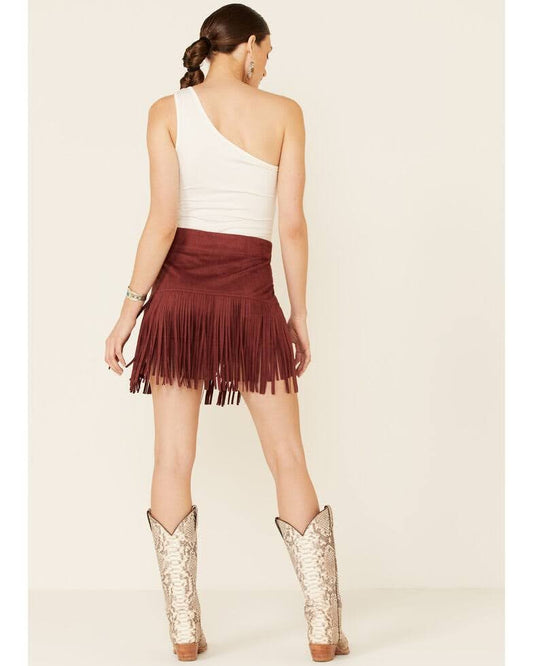 Get ready to turn heads with our Eliza Faux Suede Fringe & Studded Mini Skirt! Made with a soft, luxurious faux suede fabric, this skirt features gold-studded embellishments and a tiered style with fringe details. The zipper closure ensures a secure fit while the 87% polyurethane and 13% elastane blend provides comfortable stretch. Embrace your inner boho-chic cowgirl with this trendy mini skirt.