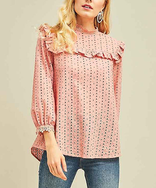 Elevate your wardrobe with our Blush Mock-Neck Top. Designed with eyelet lace and ruffle bib detail, this top exudes Boho-Chic style. The crochet lace at the sleeve and neckline adds a touch of elegance. With a keyhole button closure at the back, it's the perfect mix of modern and Western fashion. A must-have for any cowgirl with a love for bohemian and urban styles.