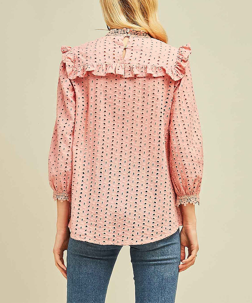 Elevate your wardrobe with our Blush Mock-Neck Top. Designed with eyelet lace and ruffle bib detail, this top exudes Boho-Chic style. The crochet lace at the sleeve and neckline adds a touch of elegance. With a keyhole button closure at the back, it's the perfect mix of modern and Western fashion. A must-have for any cowgirl with a love for bohemian and urban styles.