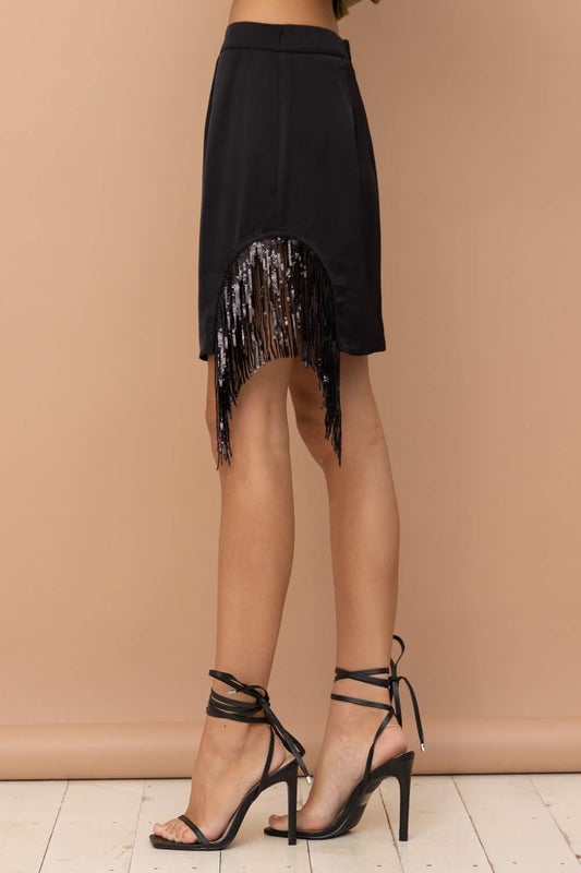 Add a touch of urban western chic to your wardrobe with the Dana Side Cut Out Sequin Fringe Mini Skirt. Featuring a side-cut out design and shimmering sequin fringe, this black mini skirt from Blue B is perfect for adding a boho-chic and cowgirl flair to your style. Elevate your western fashion game with this stylish piece.