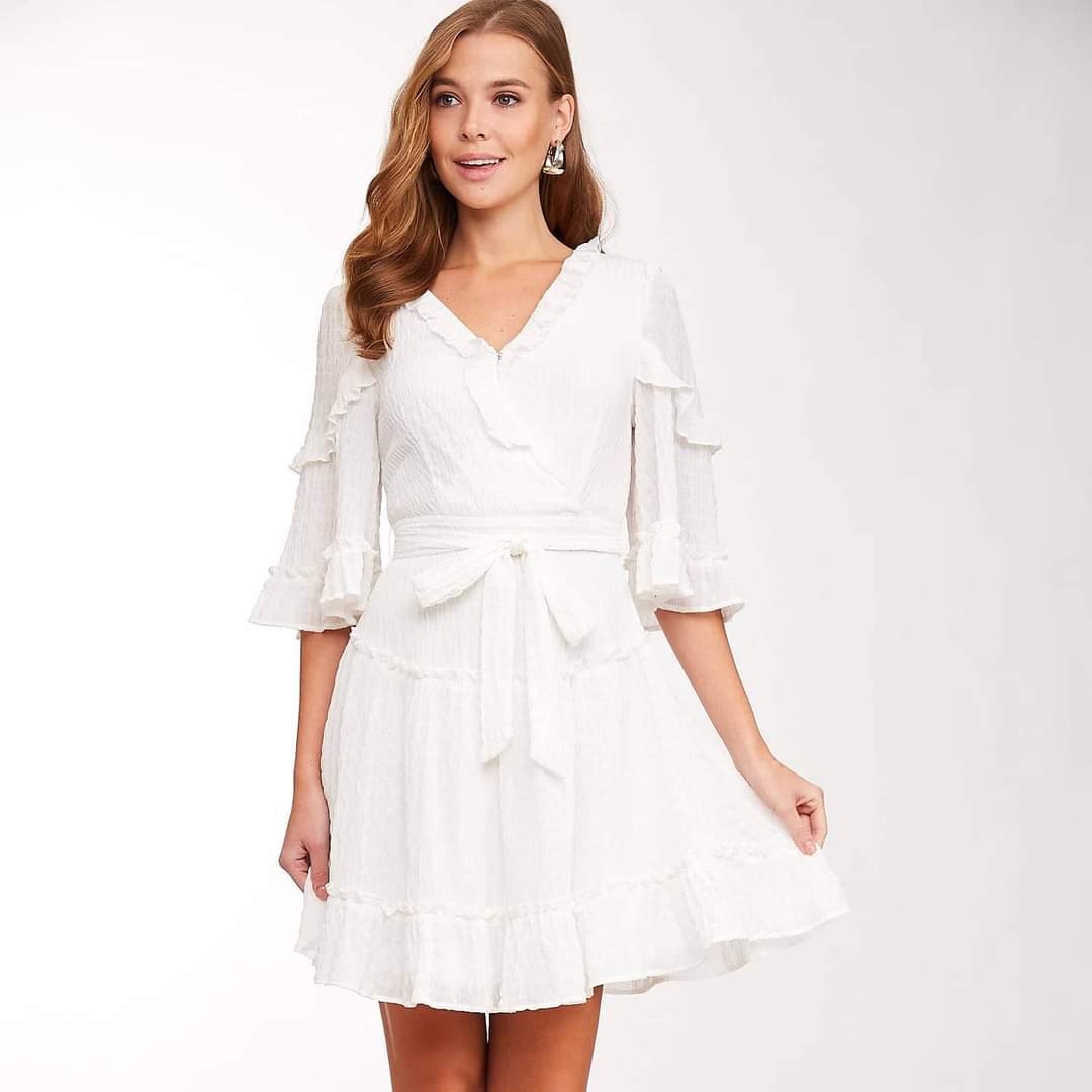 Experience bohemian-chic style in our Erin Ruffled V-neck Dress! This textured dress features a flattering V-neck, ruffled details, and a belted waist for a feminine touch. With half sleeves and a back zipper closure, it's both stylish and practical. Perfect for any occasion, this dress is a must-have for the urban cowgirl in you!