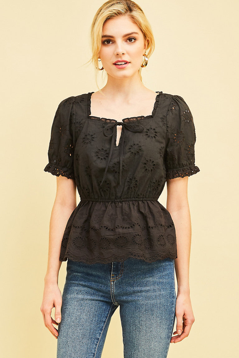 The Square-neck Peasant Top offers a stylish blend of urban western and boho-chic style. Made with a lightweight, woven fabric, this top features eyelet lace, cinched waist detail, and puff sleeves. With its non-sheer design, it's perfect for both day and evening wear. Elevate your wardrobe with this chic and bohemian-inspired top.