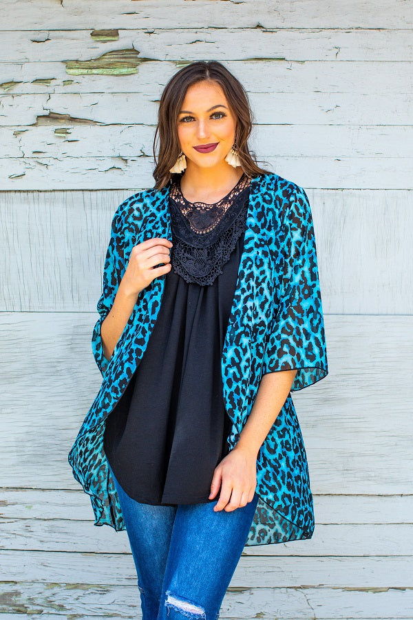 Make a statement with our Blue Leopard Kimono from Lucky & Blessed. With 3/4-sleeves, this kimono combines Urban Western, Cowgirl, and Boho styles for a chic and bohemian look. Perfect for any occasion, this kimono is an essential piece for every stylish wardrobe.