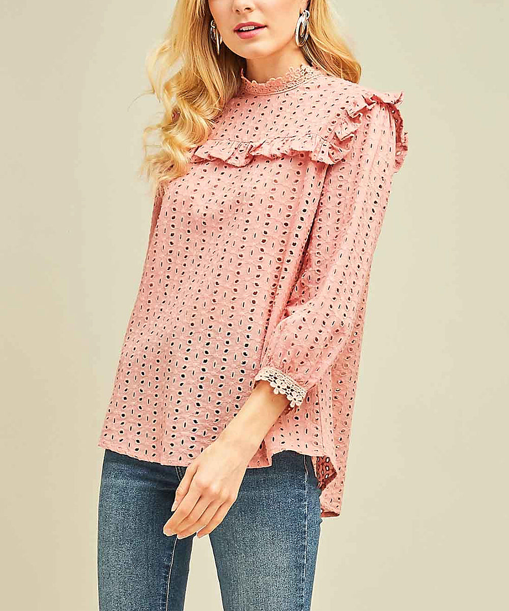 Elevate your wardrobe with our Blush Mock-Neck Top. Designed with eyelet lace and ruffle bib detail, this top exudes Boho-Chic style. The crochet lace at the sleeve and neckline adds a touch of elegance. With a keyhole button closure at the back, it's the perfect mix of modern and Western fashion. A must-have for any cowgirl with a love for bohemian and urban styles.